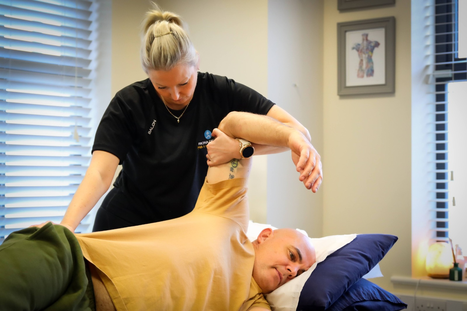 Hands-on manual therapy assessment on a treatment table