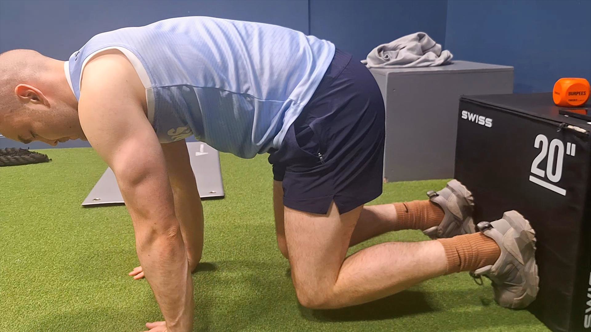 Athlete completing a box-supported core exercise