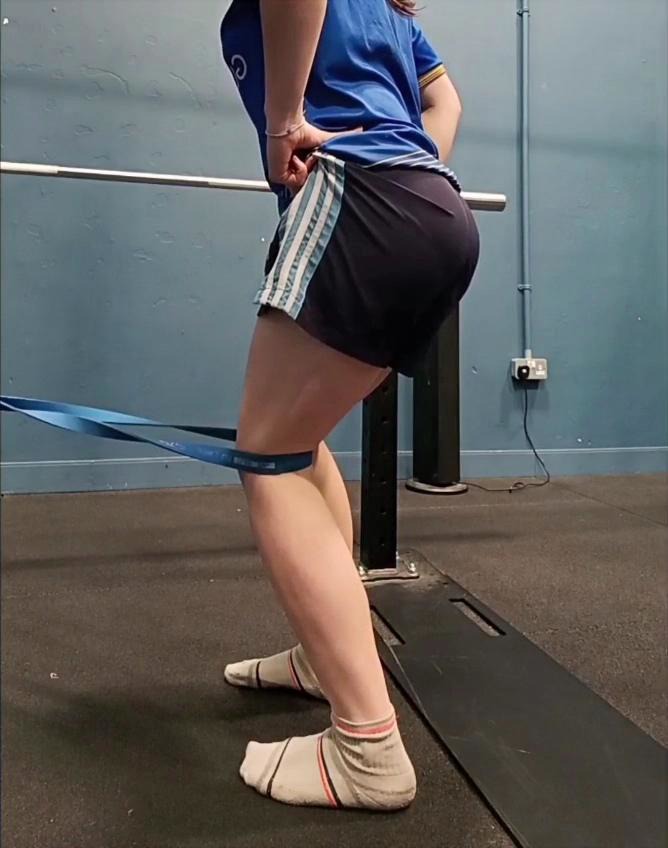 Athlete completing banded knee control work