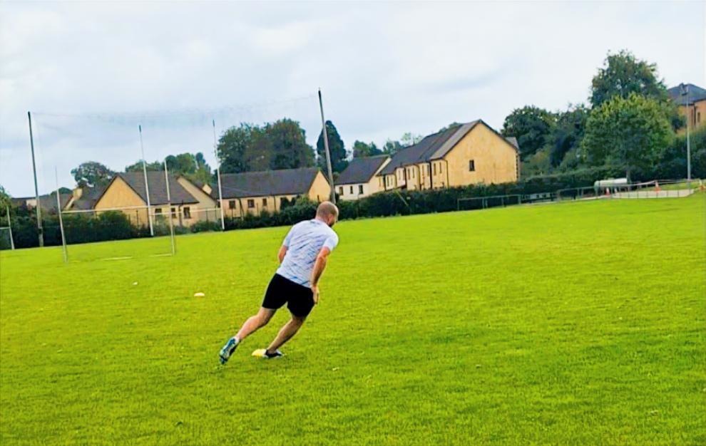 Sprint conditioning drill on an indoor pitch