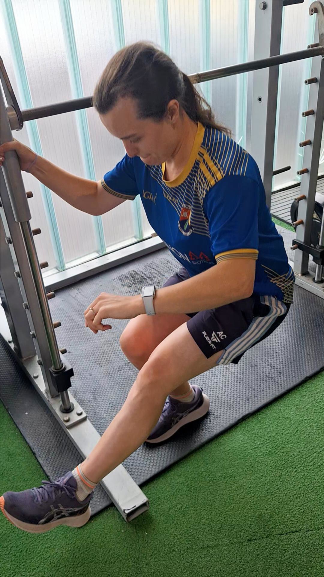 Athlete performing controlled single-leg squat work